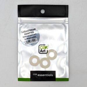 A silver and black resealable bag labeled CO2 Art and CO2 essentials contains three white washers and a sticker reading SodaStream Adapter Replacement 3x Washers. The bag is displayed on a white surface.