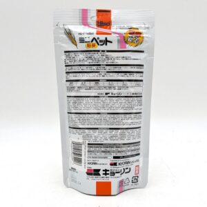 Back of a white and silver food pouch with Japanese text, a barcode, nutritional information, and an illustration of wheat. The packaging features black, red, and yellow accents.